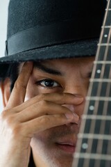 Close up portrait of latin man with the guitar