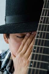 Close up portrait of latin man with the guitar