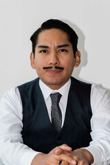 Latin man with drawn mustache headshot on white background