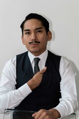 Latin man with drawn mustache headshot on white background