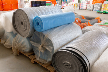 Different Insulation material in rolls for sale on a store warehouse.