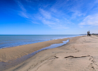 Typical sandy beach of Margherita di Savoia town in Apulia region, southern  Italy.