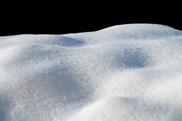 Fototapeta na wymiar white snow in daylight, background, isolate on black background