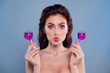 Portrait of lovely model girl pouted lips kiss hold glass cryotherapy tool bottle isolated on blue color background - obrazy, fototapety, plakaty