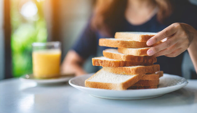 Sliced white bread on plate, woman's hand on stomach. Symbolizing gluten intolerance and dietary awareness