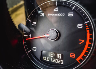 car rpm speedometer on black background