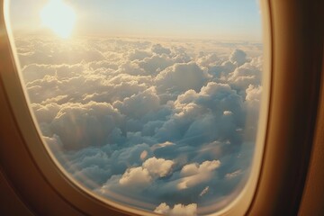 Airplane window shows clouds