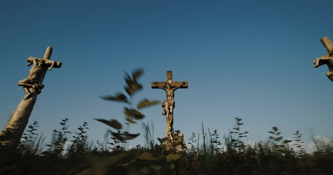 The cross on the Golgotha hill with beautiful fast moving clouds on the blue sky. Resurrection, new life, Easter video postcard.