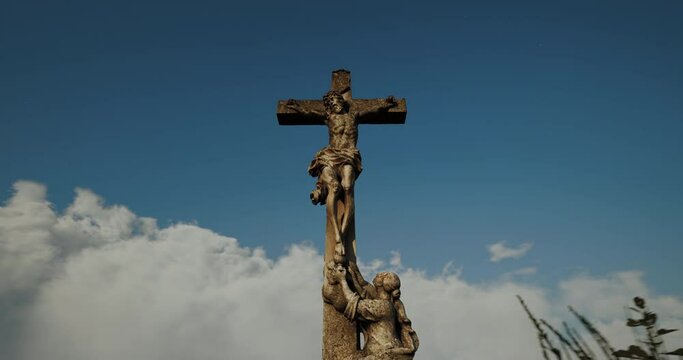 Time lapse, The cross on the Golgotha hill with beautiful clouds fast moving on the blue sky. Concept of resurrection, new life, Easter video postcard.