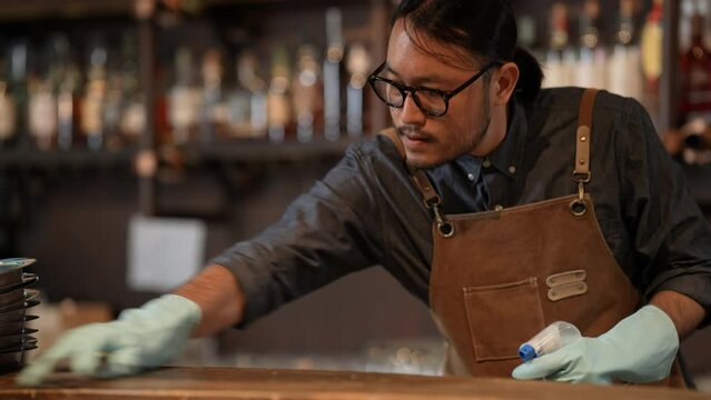 Night club concept of 4k Resolution. Asian staff cleaning the restaurant before getting ready to open. A group of specialized clubs that sell alcoholic beverages.