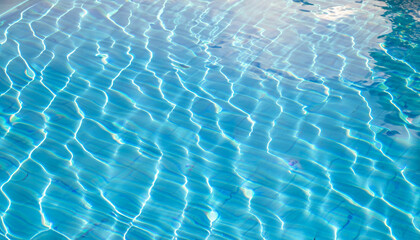 Fototapeta na wymiar Abstract pool water surface and background with sun light reflection for text copy space; concept of relax, vacation, holiday