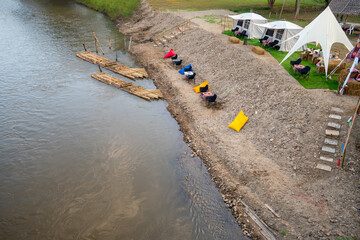ฺBeautiful landscape Camping along the river on a holiday, relaxing day, cold weather, along the bridge over the Pai River, Mae Hong Son Province, Thailand.