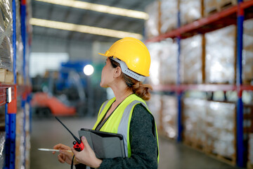 operation worker woman checking and inspecting cargo for stack items for shipping. Staff checking the store factory. industry factory warehouse. Worker Scanning Package In Warehouse.
