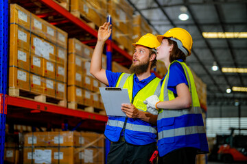 operation workers checking and inspecting cargo for stack items for shipping. males worker checking the store factory. industry factory warehouse. Worker Scanning Package In Warehouse.