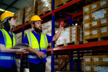 operation workers checking and inspecting cargo for stack items for shipping. males worker checking the store factory. industry factory warehouse. Worker Scanning Package In Warehouse.