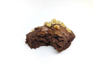 brownie cake with peanut topping isolated on white