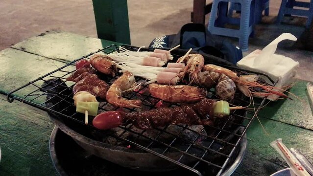 February 14, 2022 - Jomtien Beach, Chonburi Thailand. A barbecue full of meat and seafood at an all you can eat, Thai barbecue buffet.
