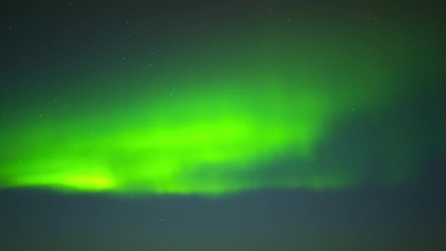 Aurora Borealis, Northern Lights in Iceland, Real Night Sky with Stars Time Lapse, Astronomical Phenomenon, Solar Wind, Earth Electromagnetic Field, Wonders of Nature in Winter Night Sky in the North