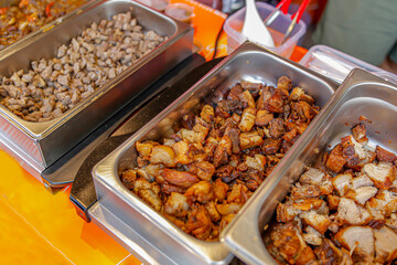 Pork slices in stainless steel tray