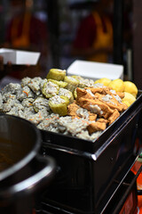Siomay, bitter melon, and chocolate tofu are in the siomay steamer