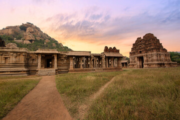 Medieval Achyuta Raya temple with ancient archaeological ruins at sunset at Hampi, Karnataka, India.