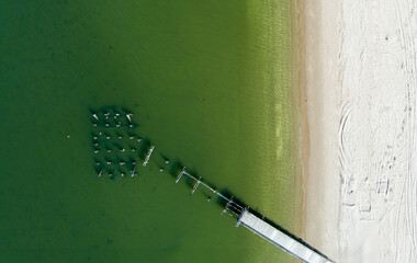 Top down drone shot of dock in water