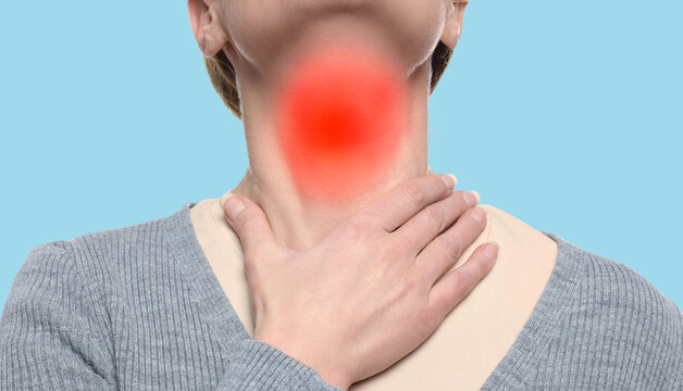 Endocrine system. Woman doing thyroid self examination on light blue background, closeup. Banner design