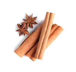 Cinnamon sticks and anise stars isolated on white, top view