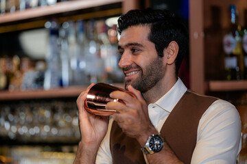 Man bartender is making a drink and dancing at bar. Dance party with group people dancing . Women and men have fun and drinking martini cocktail in night club.