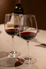 Tasting of red dry Saint-Emilion wine aged in French oak wooden barrels in cellar, Saint-Emilion wine making region, France, Bordeaux