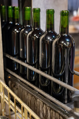 Wine making line, bottling and corking line in underground cellar, Saint-Emilion wine making region...