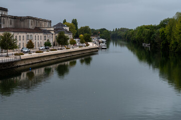 View on old streets and houses in Cognac white wine region, Charente, walking in town Cognac with...