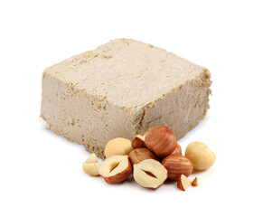 Tasty halva and hazelnuts isolated on white