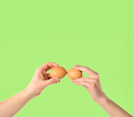 hands holding eggs with free space for text