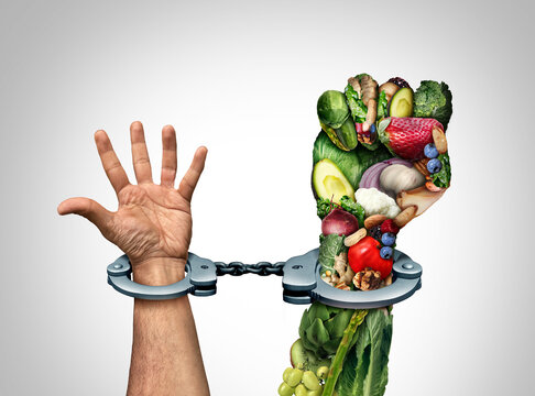 Orthorexia Nervosa Food Obsession and obsessed with Healthy eating concept or addicted to health food symbol as an extreme eating habit of consuming only certain foods as human hands shackled in cuffs