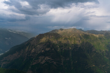 View of the Great Caucasian Ridge opening from the Upper station of the cable car system of the Dombay ski resort on a summer day, Karachay-Cherkessia, Russia