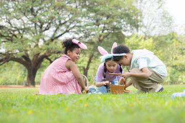 Children enjoying outdoor activities in the park including a run to collect beautiful Easter eggs.