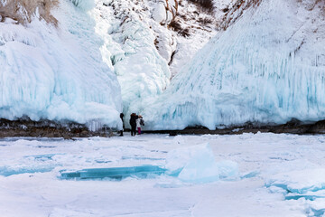 Baikal Lake in winter. Cape Sagan-Khushun or Three Brothers Cliffs are famous among tourists for...