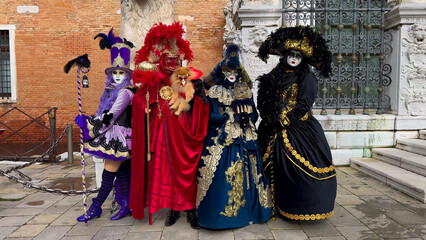 Fototapeta na wymiar Venice Carnival. People in Venetian carnival masks and costumes on streets of Venice, Italy, Europe February 10, 2024