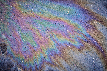 Obraz premium Oil petrol water pollution. Ecological disaster. Slick industry oil fuel spilling water pollution.