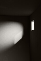 A black and white background with light coming through the building structure. 3d rendering.