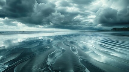 A vast windy beach with rippled waters reflecting the sky, giving a sense of openness and movement