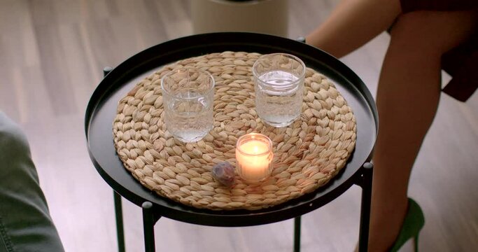 Water readily available on the table during a psychotherapy session. Create sense of comfort and relaxation, helping to ease any tension or anxiety the client may be experiencing. Care and hospitality