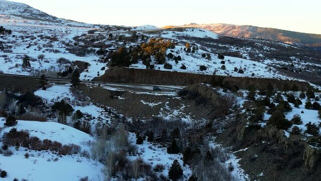 Drone footage of a sprinter van all alone near the Sawatch Range in Colorado during sunset