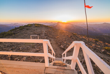 Fototapeta premium Trail Passing Fire Lookout At Dusk