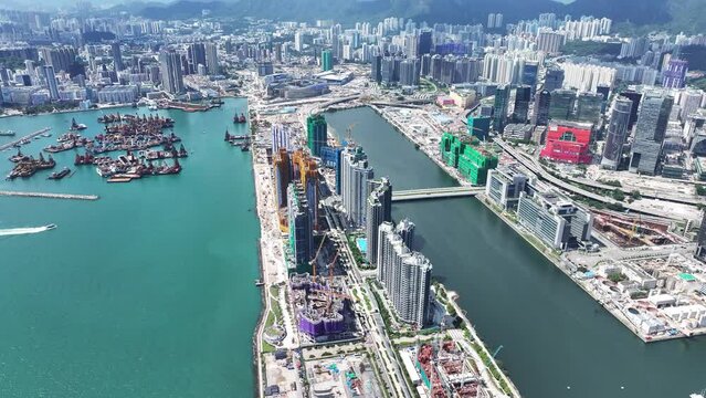 Seaside Commercial residential construction site in Kai Tak Cruise Terminal Hong Kong city, Kwun Tong, and Kowloon Bay near Victoria harbour, Aerial drone Skyview