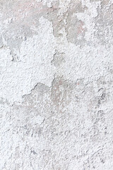 white old wall with layered shabby plaster texture. stucco wall background.