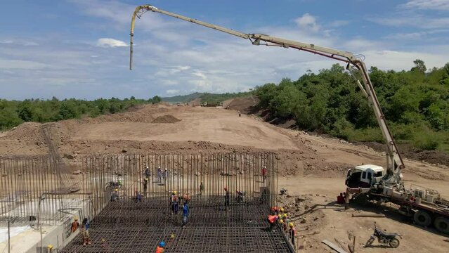 Aerial view of road construction activities using heavy machinery and equipment
