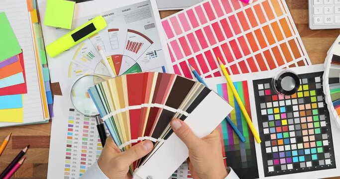 Male designer or architect chooses color from color palette
