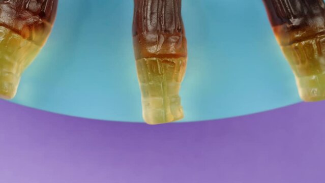 Jelly marmalade cola bottle bear close up, Confiture Bean candy jujube Marmalade bears with cod cannabis close up. 